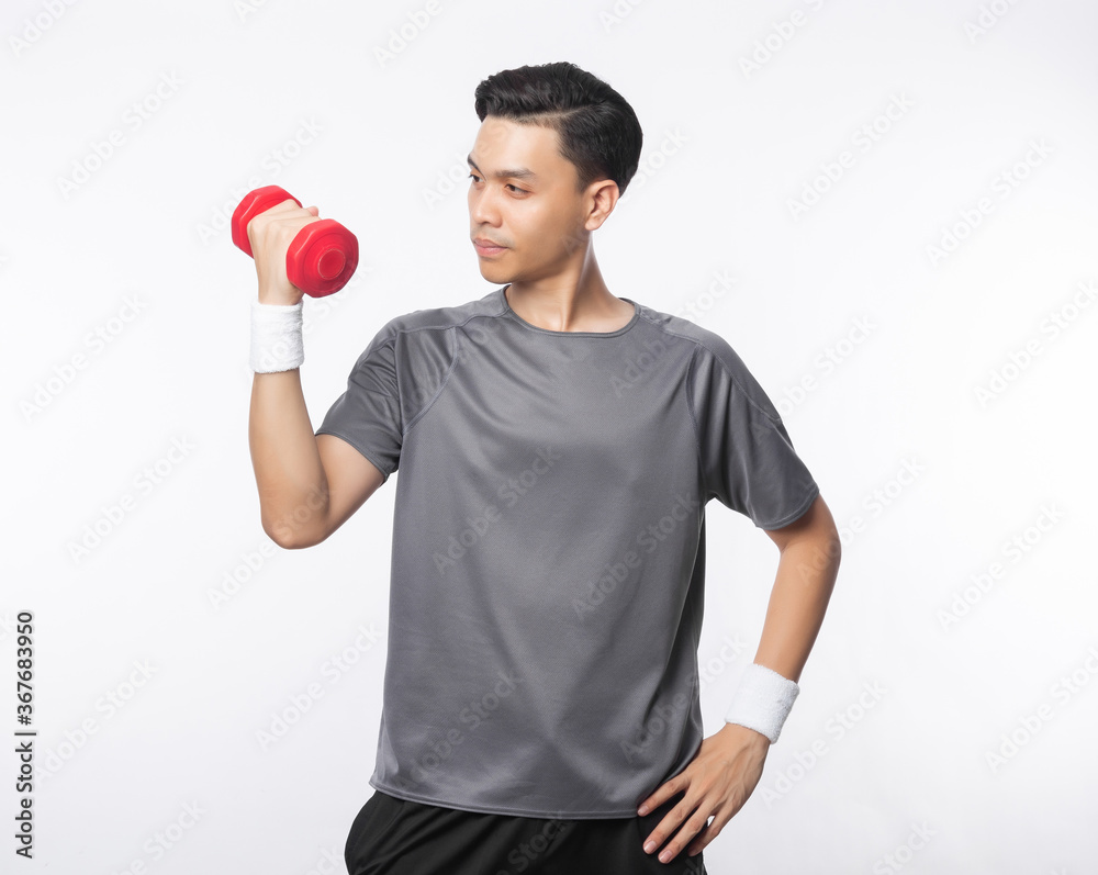 Young handsome asian man in sport outfits exercising with dumbbell isolated on white background.