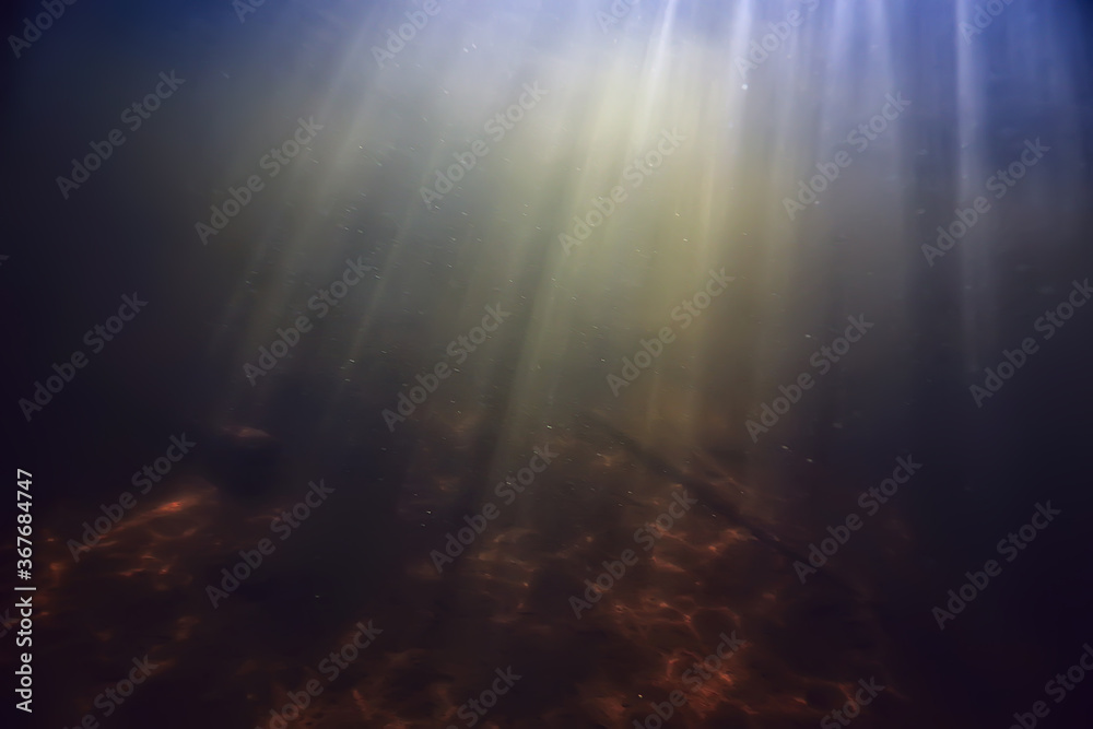 Obraz premium rays of light under water, abstract marine background nature landscape rays blurred