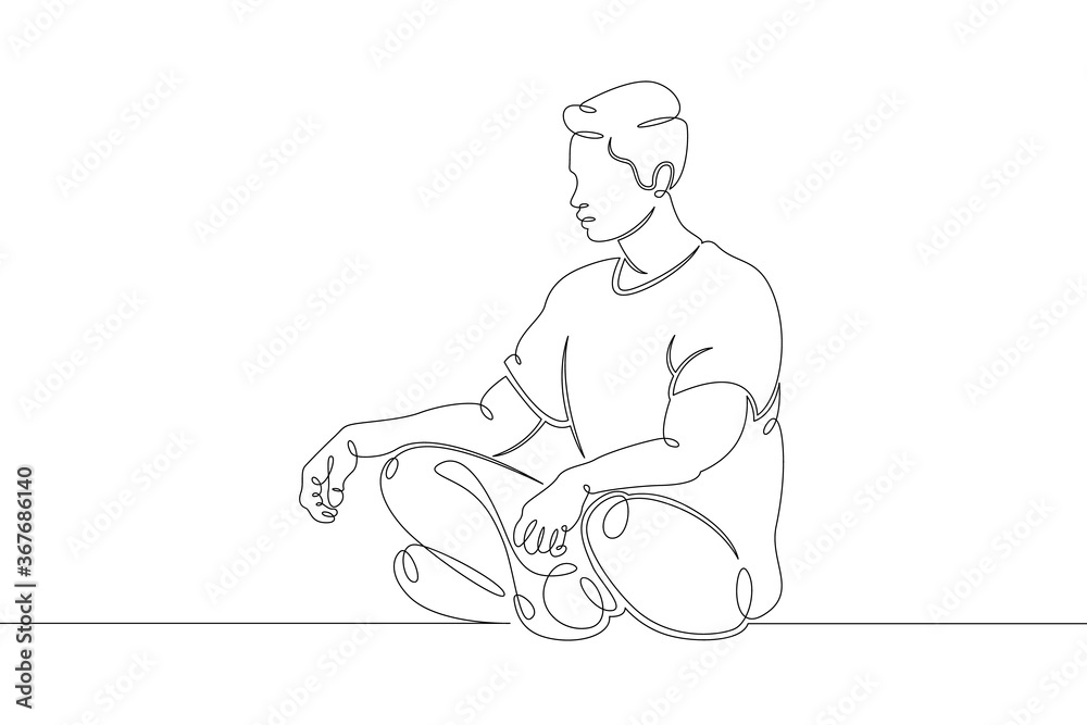 young man meditates relaxes in lotus position