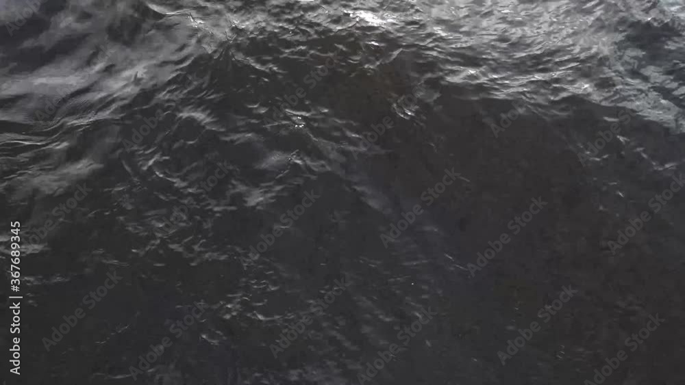 Dark waters, dark surface of a river with waves, Dark waters, dark surface of a river with waves,