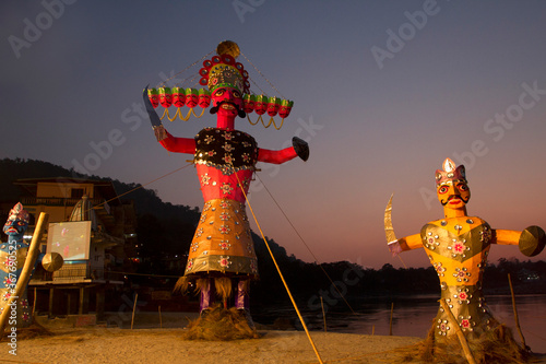 Statue of Ravana and Meghnath on the banks of river Ganga, Rishikesh, during dushera festival. photo