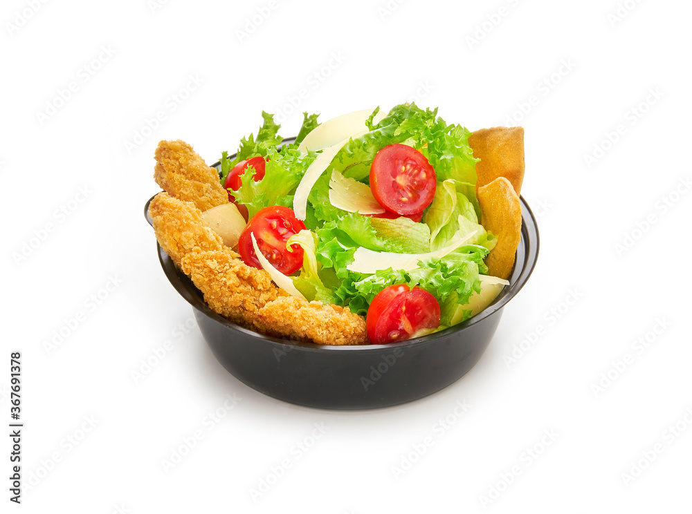 Caesar salad with lettuce, cherry tomatoes, parmesan and fried chicken in plastic bowl isolated on white background, fast food delivery concept for menu Caesar salad with lettuce, cherry tomatoes, parmesan and fried chicken in plastic bowl isolated on white background, fast food delivery concept for menu