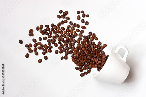 Top view of ceramic cup and coffee beans