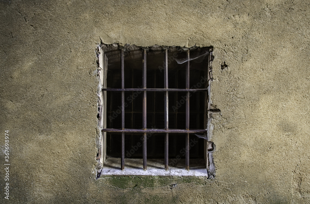 Old window with rusty bars