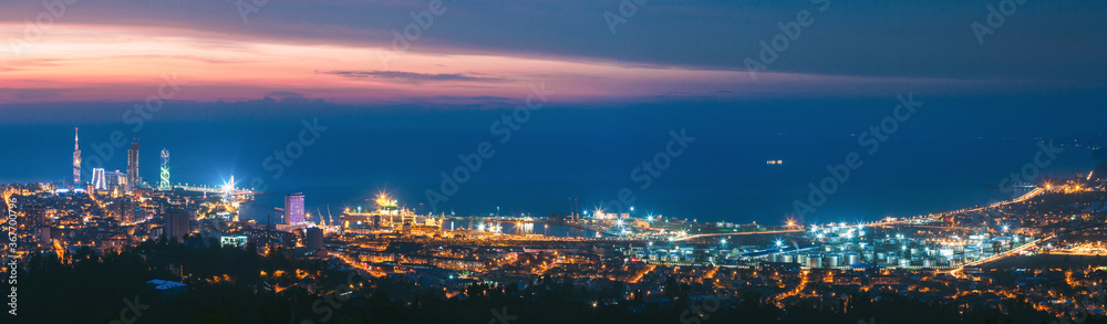 Batumi, Adjara, Georgia. Panorama, Aerial View Of Urban Cityscape At Sunset. Town At Evening Blue Hour time. City And Port In Night Lights Illuminations