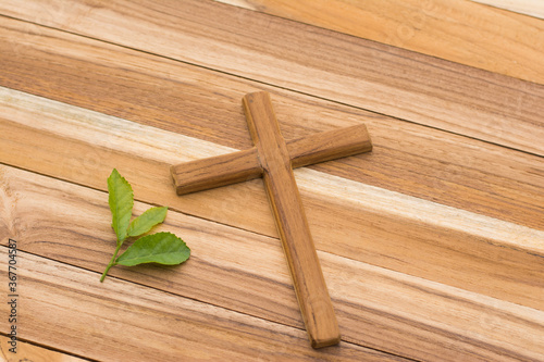 Wood cross or religion symbol shape over wood background for God.