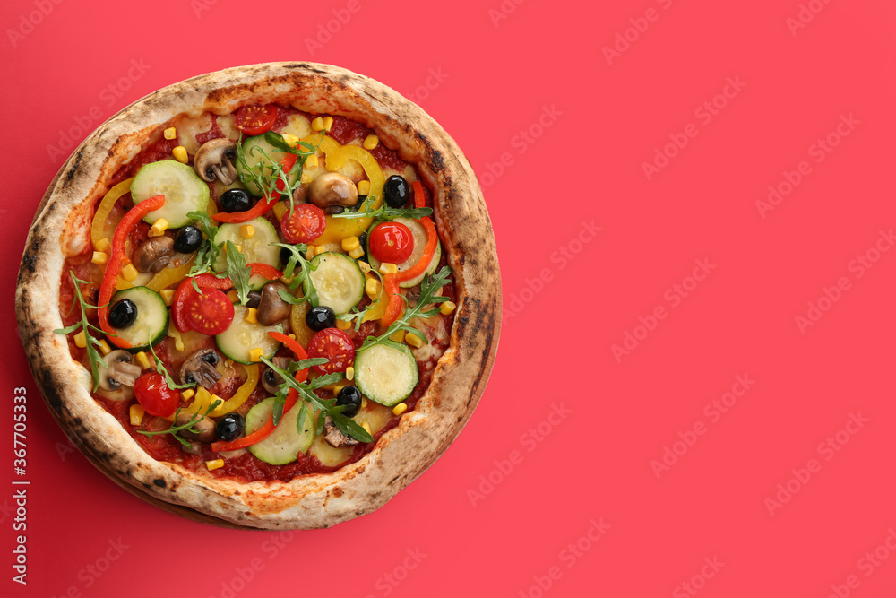Fototapeta Delicious hot vegetable pizza on red background, top view. Space for text