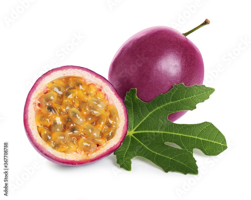 Fresh ripe passion fruits (maracuyas) with green leaf isolated on white