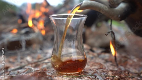 The most delicious tea made on  fire in the forest photo