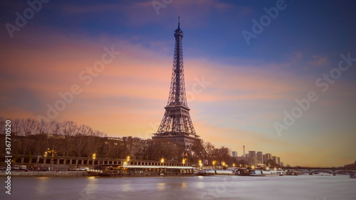 Eiffel tower in Paris, France with Scenic panorama of the river Seine under the twilight skyline