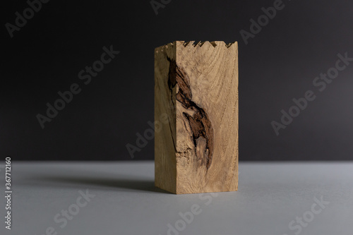 Wooden oak block on gray black background (ID: 367712160)