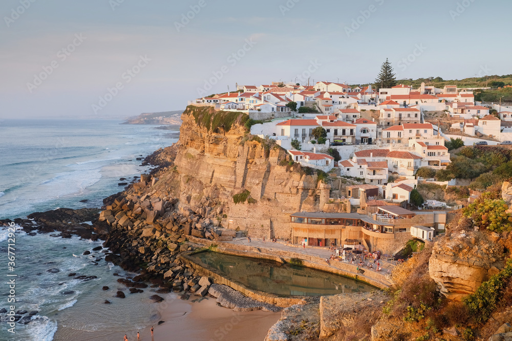 A sunset shot of the beautiful Portuguese seaside village of Azenhas do Mar.