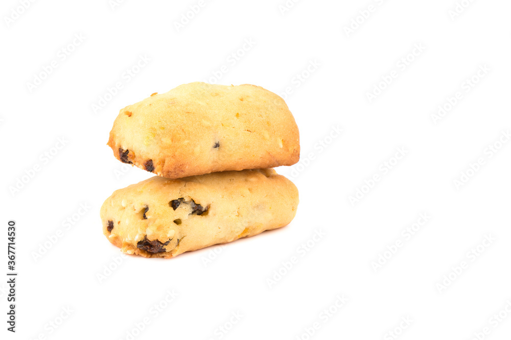 Freshly baked homemade cookies with raisins on another cookie isolated on a white background. Freshly baked homemade cookies with raisins on another cookie isolated on a white background.