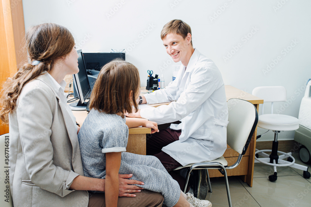 Mother and daughter came to pediatrician for health examination. Mother and daughter came to pediatrician for health examination.