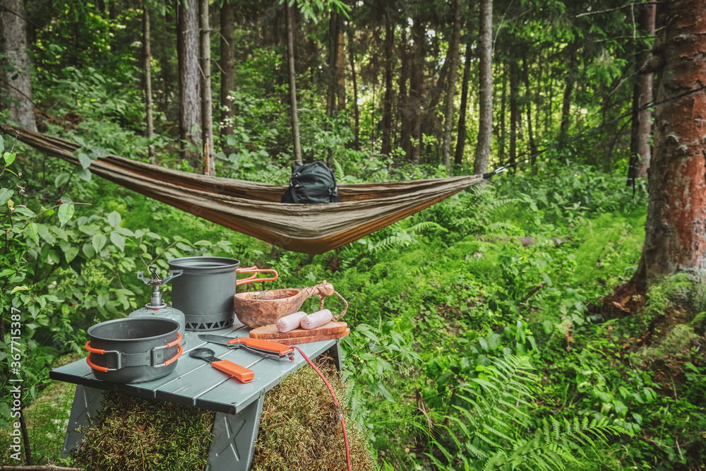 Prepare food while hiking with a backpack. Prepare food while hiking with a backpack.