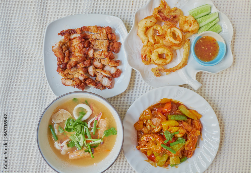 Traditional Roasted streaky pork, Tom Yum kung, Fried Calamari and Sweet and Sour Chicken, manu set for dinner Traditional Roasted streaky pork, Tom Yum kung, Fried Calamari and Sweet and Sour Chicken, manu set for dinner