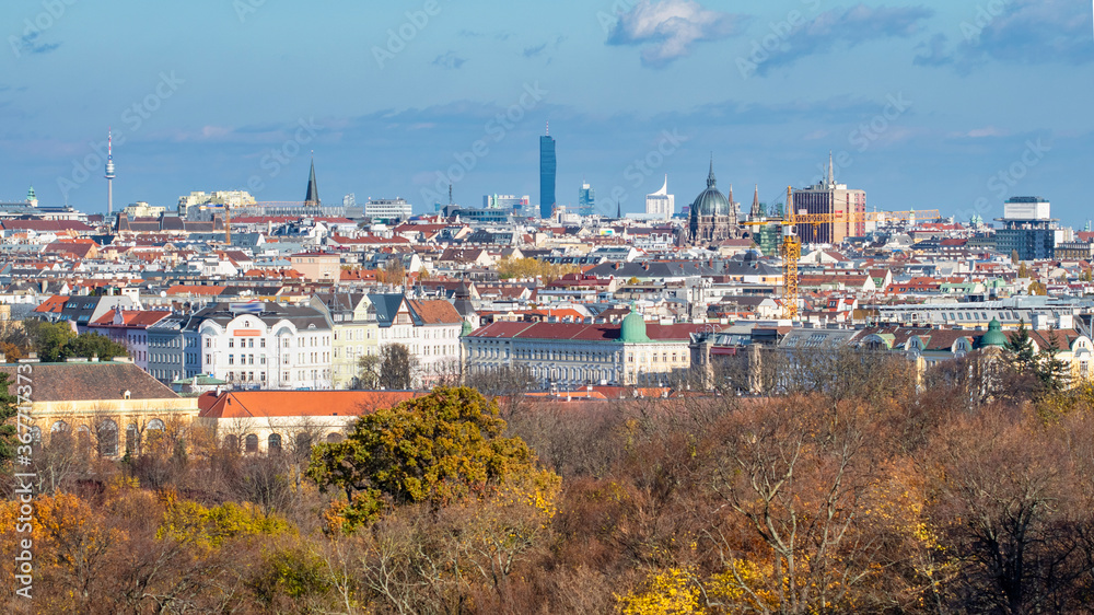 Urban landscape with roofs of historic and modern buildings in Vienna.