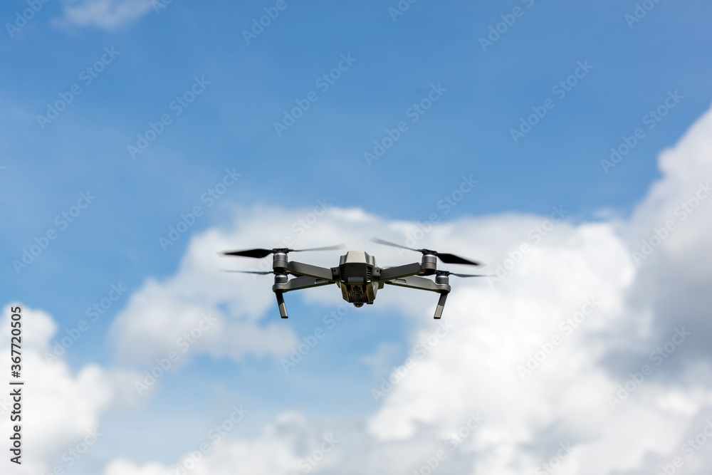 Drone copter flying with digital camera.Drone with high resolution digital camera. Flying camera take a photo and video.The drone with professional camera takes pictures of the misty mountains. Drone copter flying with digital camera.Drone with high resolution digital camera. Flying camera take a photo and video.The drone with professional camera takes pictures of the misty mountains.