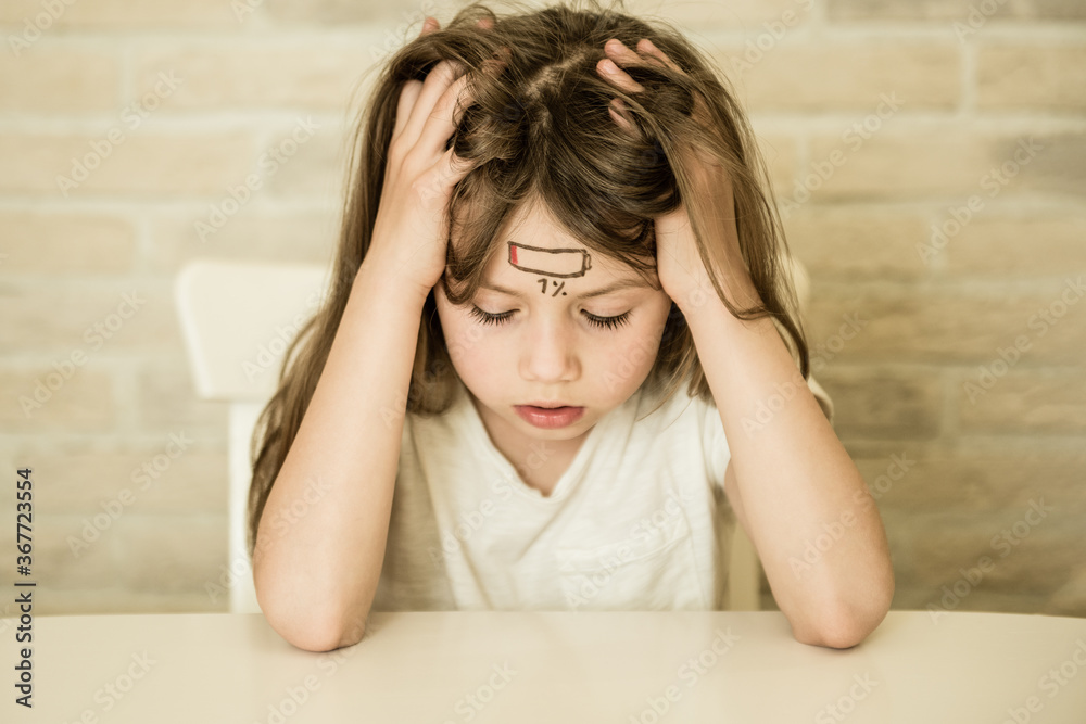Tired child girl with low charge icon, stress and fatigue concept Tired child girl with low charge icon, stress and fatigue concept