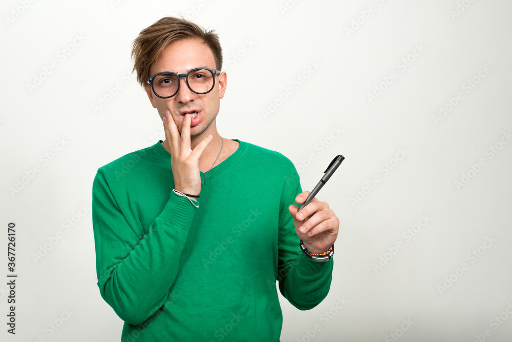 Portrait of nerd man with blond hair wearing eyeglasses Portrait of nerd man with blond hair wearing eyeglasses