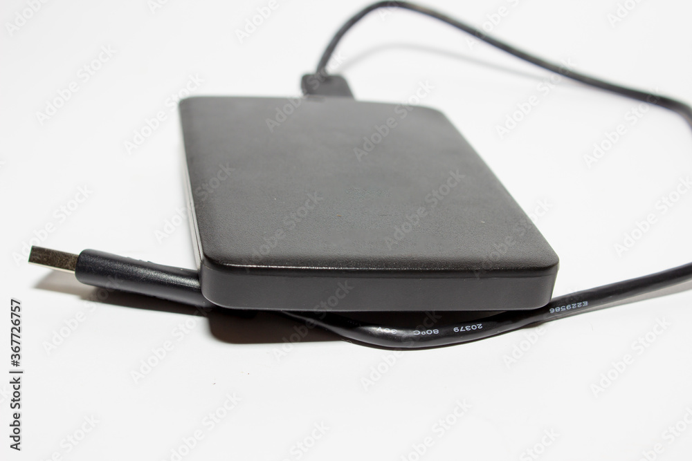 External hard drive with usb cable. White background External hard drive with usb cable. White background