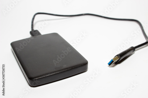 External hard drive with usb cable. White background