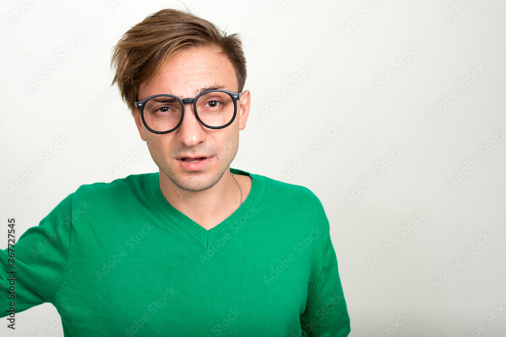 Portrait of nerd man with blond hair wearing eyeglasses Portrait of nerd man with blond hair wearing eyeglasses