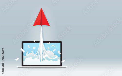Leinwand Poster Startup business project concept with red paper plane launch from laptop screen