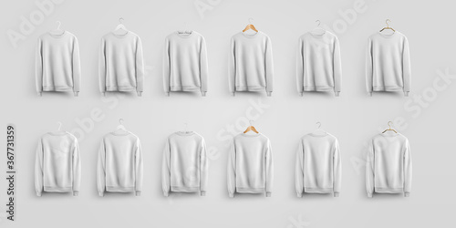 Mockup of empty white sweatshirt on wooden  metal  fabric and plastic hangers  men s clothing for design presentation.