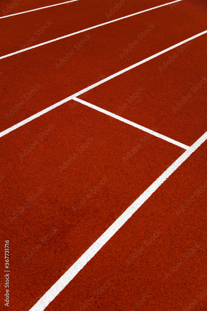 Red stadium running tracks closeup