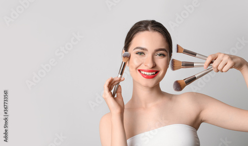 Young woman with makeup bru...