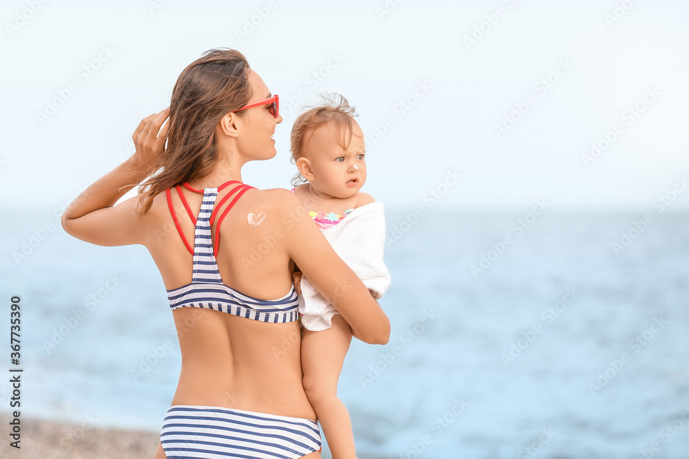 Mother and her little daughter on beach Mother and her little daughter on beach