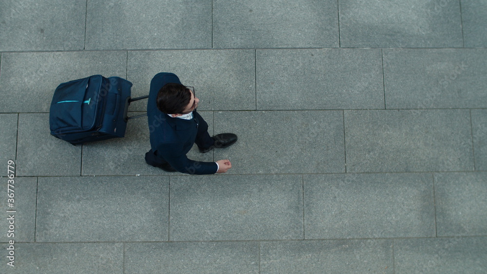 Fotografie Top view businessman walking with suitcase