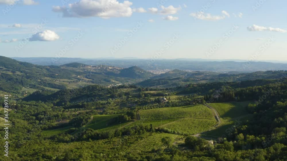 Italy aerial Landscape, Tuscany aerial landscape. Flying over the tuscan countryside, with vineyards and olive field with traditional house. Florence on background. Aerial Florence countryside. Italy aerial Landscape, Tuscany aerial landscape. Flying over the tuscan countryside, with vineyards and olive field with traditional house. Florence on background. Aerial Florence countryside.