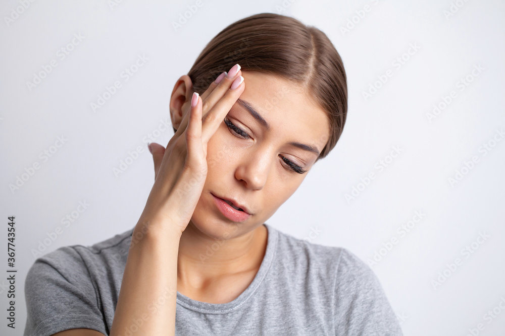 A young woman has a severe headache A young woman has a severe headache