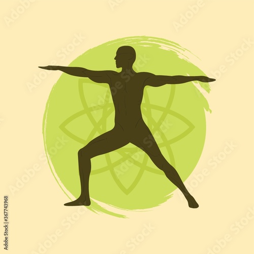 man practicing yoga in warrior ii pose