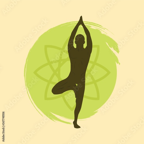 man practicing yoga in tree pose