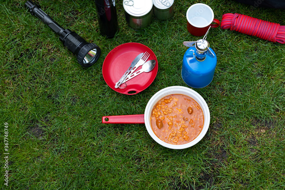 Naklejka premium Camping tools on the grass