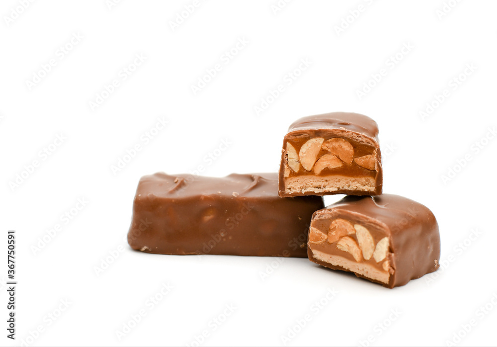 dark chocolate with nuts and caramel on a white background dark chocolate with nuts and caramel on a white background