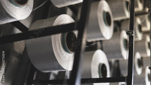 Microfiber filament production. Concrete admixtures. The skeins of thread rotate around their axis.