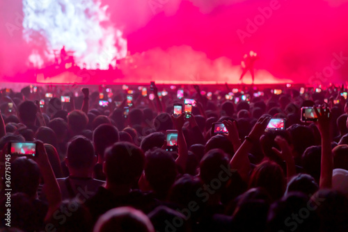 blur of People shooting video or photo in music brand showing on stage or Concert Live, party concept