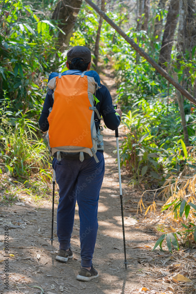traveler man hiking enjoying in the mountains with backpack at Khao Chang Puak mountain Thailand traveler man hiking enjoying in the mountains with backpack at Khao Chang Puak mountain Thailand