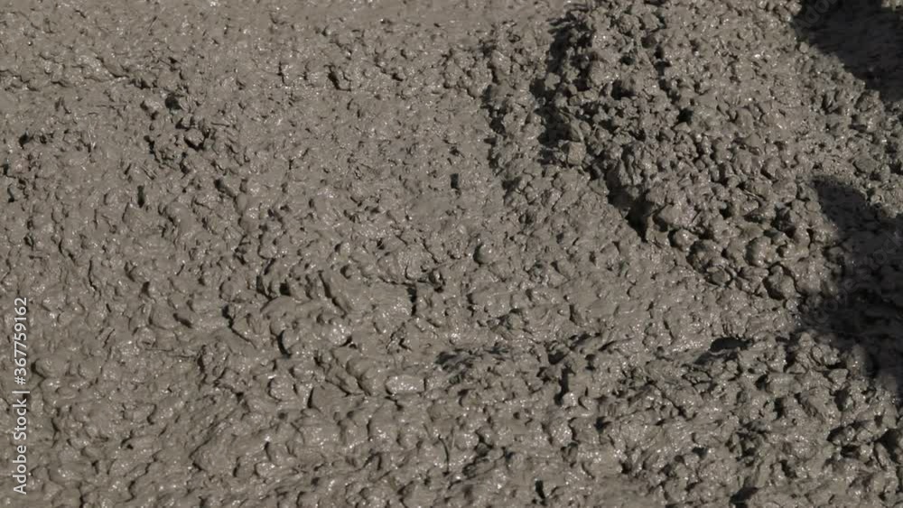 The concrete mix is fed from a concrete mixer. Concreting. Concrete floor. The concrete mix is fed from a concrete mixer. Concreting. Concrete floor.