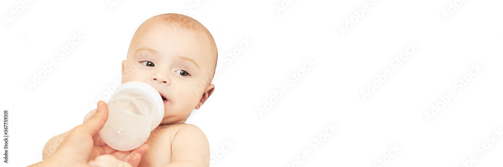Little pretty kid. Lying at home. White background. Eat milk. Male child portrait. Mother care. Funny sensitive human. Horizontal banner with copyspace. Look at side. Drink water Little pretty kid. Lying at home. White background. Eat milk. Male child portrait. Mother care. Funny sensitive human. Horizontal banner with copyspace. Look at side. Drink water