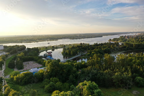 a large city with churches from the embankment along the river filmed from a drone © константин константи