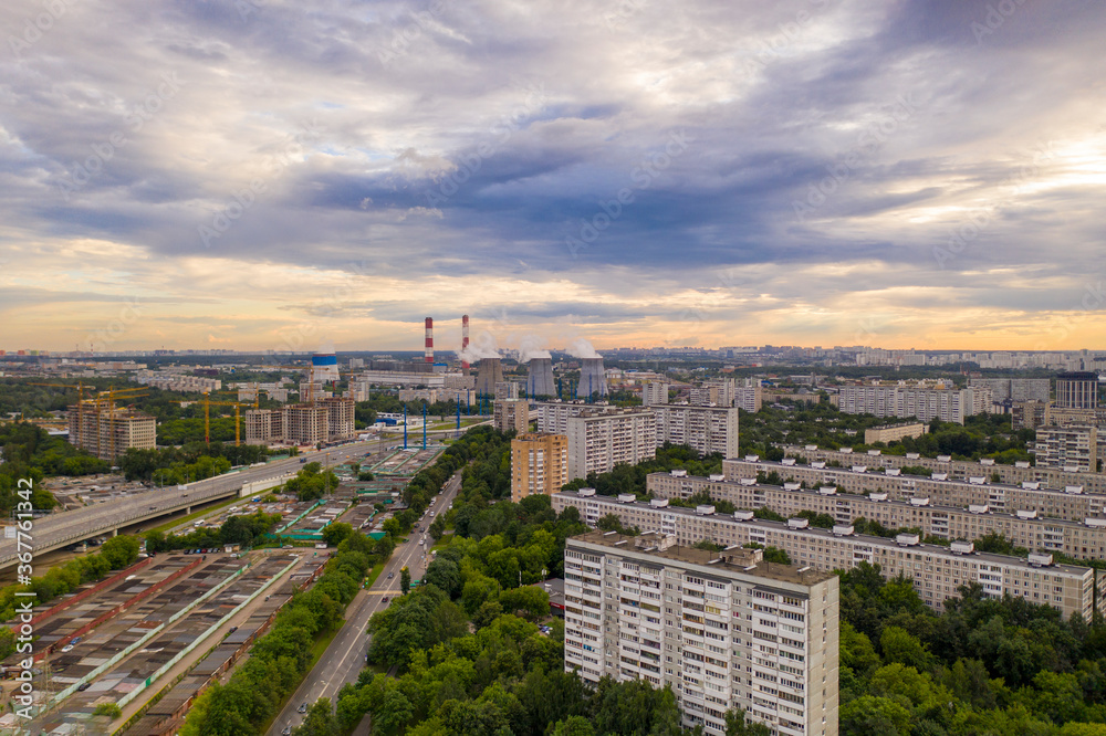 panoramic view of the morning city with roads, cars and junctions panoramic view of the morning city with roads, cars and junctions