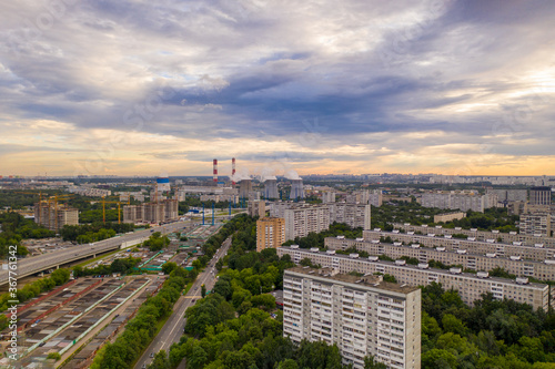 panoramic view of the morning city with roads, cars and junctions