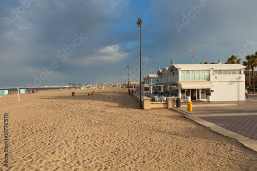 El Cabanyal beach with restaurant pavillions at sunset, Valencia, Spain.