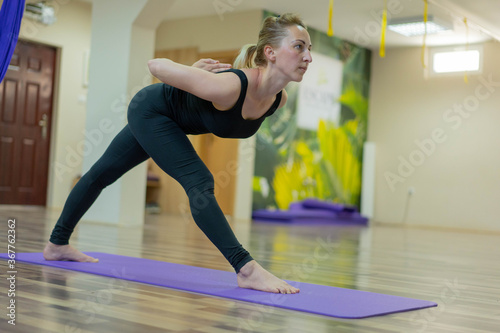 Young woman exercising yoga.
