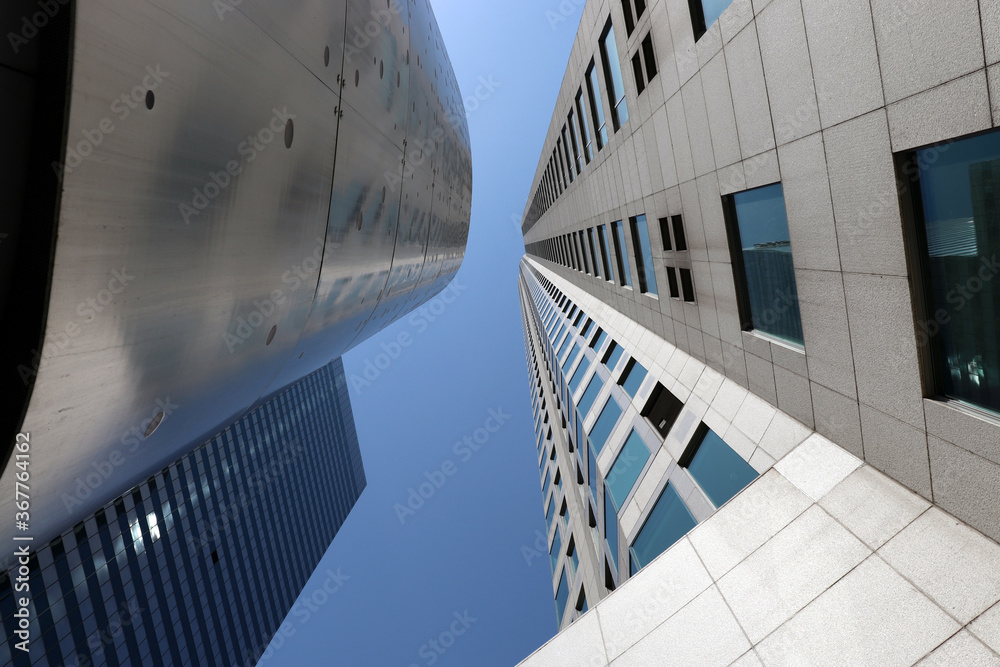 Fototapeta premium Skyscrapers from below against blue sky in LA
